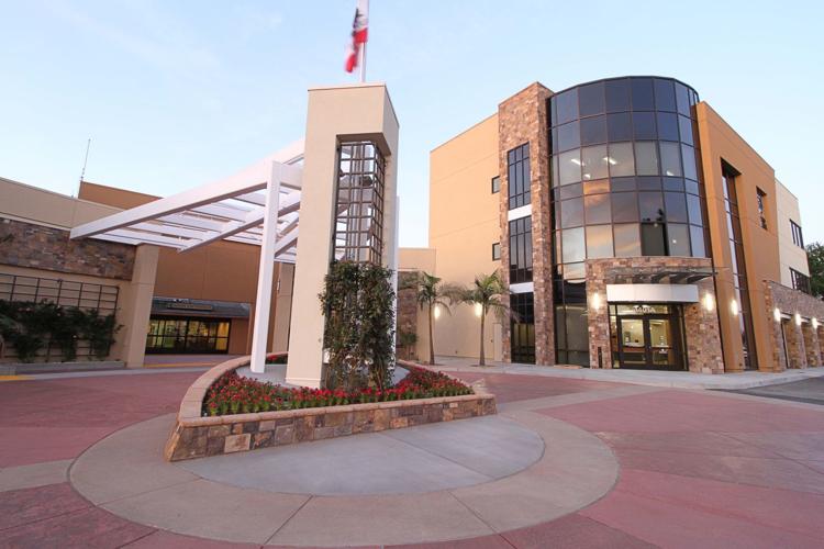 The glass curtain-wall entrance of the Delano Regional Medical Center outpatient building